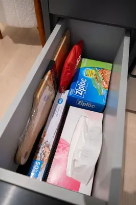 a drawer filled with different types of items at Brand New Cozy Suite near Collingwood School in West Vancouver