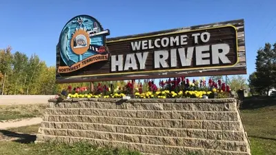 a sign that says welcome to hay river at Private Rooms in a Wonderful House in Hay River