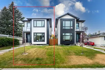 a house with two red squares in front of it at Luxury Home Near DT, New Build, High-End Features in Calgary