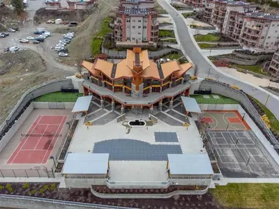 an overhead view of a large building with a tennis court at Copper Sky Paradise in West Kelowna