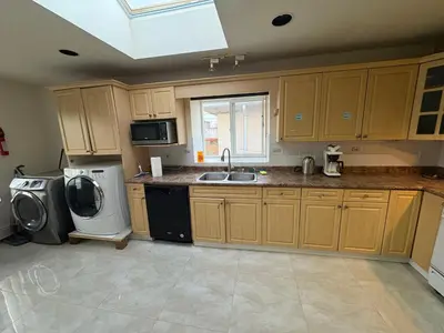 a kitchen with a sink and a dishwasher at Vancouver Home - Downtown 15 Min, Transit Access - Free Parking & Wi-Fi in Vancouver