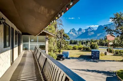 a building with a view of the mountains at Gateway Suites Sweet Getaway near Canmore and Banff in Canmore