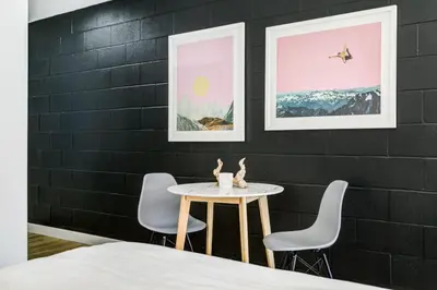 a dining room with a table and two chairs at Gateway Suites Cozy Getaway Near Banff and Canmore in Canmore