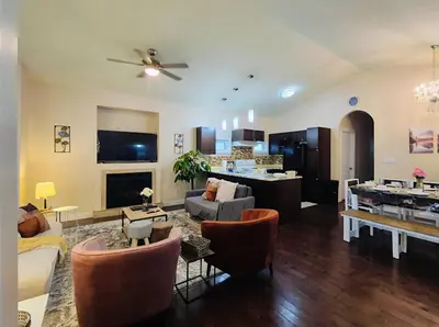 a living room with a couch and a table at Central 3 Bedroom Gem Near ICE District - Stadium and Malls in Edmonton