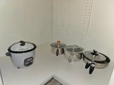 three pots and pans on a counter in a kitchen at Kirvia's retreat 