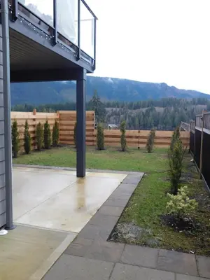 a patio with a deck with a view of a fence at Lakeview Escape in Northshore Estates in Lake Cowichan