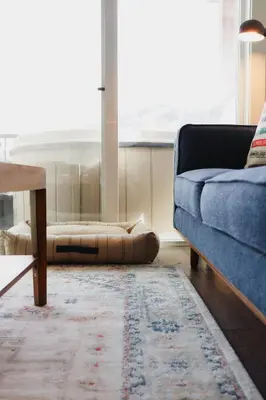 a living room with a couch and a table at The Après Arcade in Sun Peaks