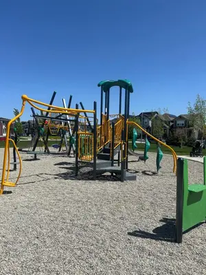 a playground with a bunch of playground equipment at Sunny Queen-size Bedroom with Private Bath in Brand New House in Calgary
