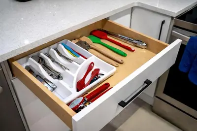 a drawer withrenches and other tools in a kitchen counter at New 2BR Suite, Walk to Dining, Near Downtown in Calgary