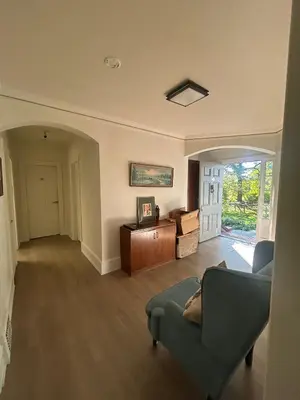 a living room with a couch and a table at Vancouver Guest House - Airport 10 Min, Downtown 15 Min - Free Parking & Fast Wi-Fi in Vancouver