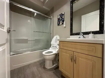 a bathroom with a shower and a toilet and a sink at Bright & Cozy 1B1B in Vancouver-close to YVR Airport & DT, Free Parking, Private Entrance, in Vancouver