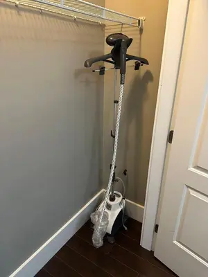 a vacuum cleaner in a room next to a door at Bright & Cozy 1B1B in Vancouver-close to YVR Airport & DT, Free Parking, Private Entrance, in Vancouver