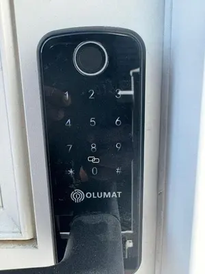 a close up of a remote control in a window at Modern comfort just 20 minutes from the airport, with a full kitchen in Edmonton