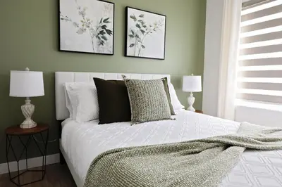 a bedroom with a white bed with two lamps at Kinglet 4BR Getaway AC Garage Near WEM DisneyPlus in Edmonton