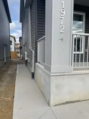 a building with a sign on the side of it at Bedroom in the basement Upland 1 in Edmonton
