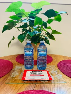 two bottles of water sitting on top of a table at Casa Del Mar-A family Suite in Victoria in Langford