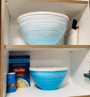 a shelf with a bowl and other items on it at Casa Del Mar-A family Suite in Victoria in Langford