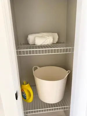 a bathroom with two towels and a bath tub at Casa Del Mar-A family Suite in Victoria in Langford