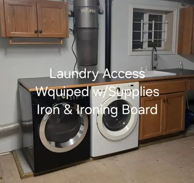 a washer and dryer in a kitchen with the words laundry access renovated my at Self Check-In Keyless Private Entry DBL Queen Suite in Mission City