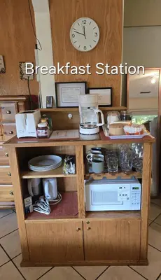 a kitchen with a breakfast station with a clock at Self Check-In Keyless Private Entry DBL Queen Suite in Mission City