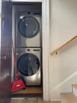 a washer and dryer sitting in a room at The Golden Sky Sanctuary at the Algonquin Residence in Prince Rupert