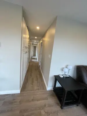 a hallway of a house with a table and a couch at 3 BR Serene Forest Sanctuary in Port Edward