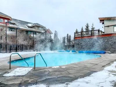 a swimming pool with snow on the ground at 3BR Family Friendly Getaway Pool and Hot Tub in Canmore