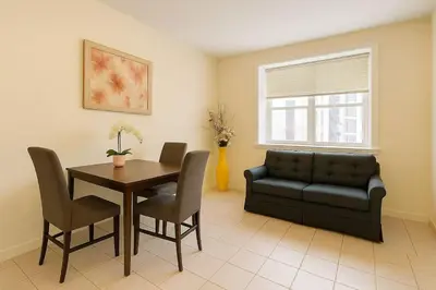 a living room with a table and a couch at Sweet 2-bedrooms house in Vancouver in Vancouver