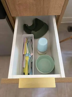 a model of a drawer with utensils and a hat at New! Spacious Bright Home in GREAT Location in Red Deer