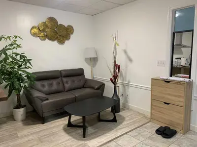 a living room with a couch and a table at ArtHaus Downtown Jim Robb Unit 3BR 3BA in Whitehorse