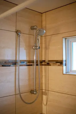 a shower in a bathroom with a glass wall at Cozy 3BR Family Home near City Centre & SkyTrain in Coquitlam