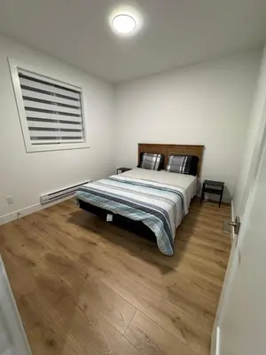 a bedroom with a bed and a window at Brand new fully private Garden Suite 1 in Delta