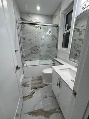 a white bathroom with a toilet and a sink at Brand new fully private Garden Suite 1 in Delta