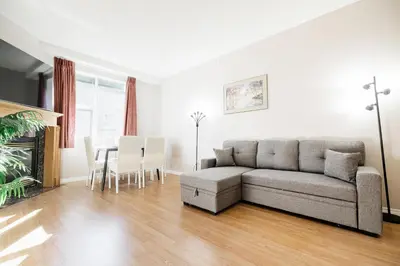 a living room with a couch and a table at Cozy Canmore 2-Bedroom Retreat in Canmore