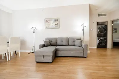 a living room with a couch and a table at Cozy Canmore 2-Bedroom Retreat in Canmore