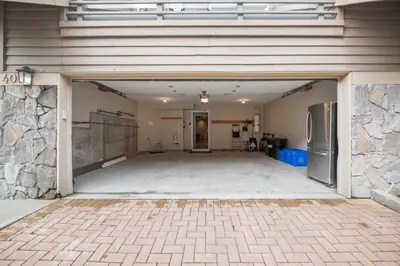 an empty parking lot with a large garage at Englewood Greens 40 by Outpost Whistler in Whistler