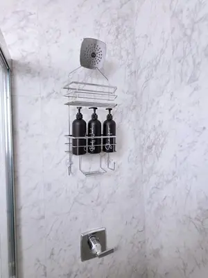 a bathroom with three wine bottles on a wall at New Langford Suite near Lake & Mall, Free Parking in Goldstream Station
