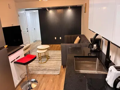 a living room with a couch and a table at Home away from Home in Edmonton
