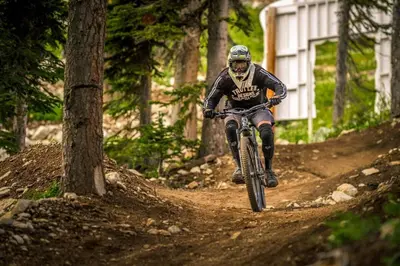 a person riding a bike on a dirt trail at Raven's Nest - Mtn View & Hot Tub sleeps 6 in Carmi