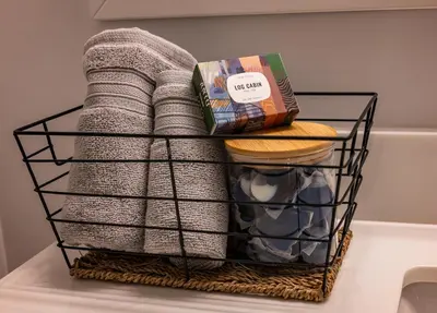 a basket filled with towels and a towel at Bearberry Premium Rentals in Whitehorse