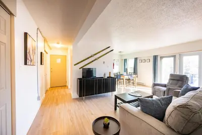 a living room with a couch and a table at Bearberry Premium Rentals in Whitehorse