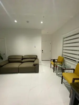 a living room with a couch and a table and chairs at Sunshine A in Vancouver