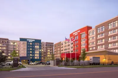 a row of tall buildings in a parking lot at Residence Inn by Marriott Calgary South in Calgary