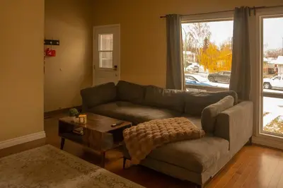 a living room with a couch and a table at Mi Light House \u7c73\u62c9 in Yellowknife