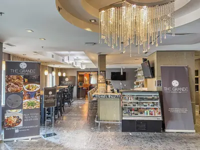 a restaurant with a food counter and a buffet at 2BR Scenic Rockies Retreat BBQ Hot Tub and Pool in Canmore