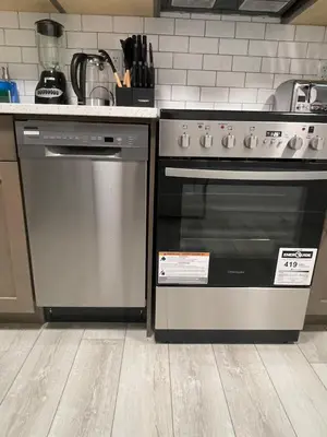 a kitchen with a stainless steel oven in a kitchen at Cozy and modern two bedroom guest suite in Calgary