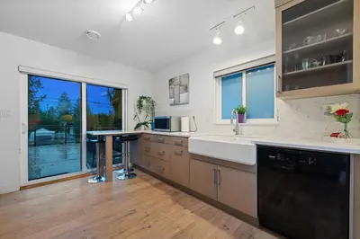 a kitchen with a sink and a counter top at Renovated North Vancouver Gem in North Vancouver