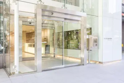 a large glass door in a building at Corporate Stays Telus Gardens 1 Bedroom in Vancouver