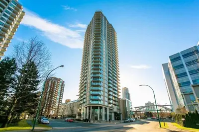 a tall building in the middle of a city at Corporate Stays Hazel 1 Bedroom in Burnaby
