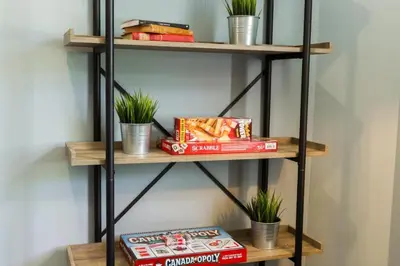 a shelf with snacks and potted plants on it at 5BDRM Bright Modern Home-King Bed-Garage-Sleeps 12 in Edmonton